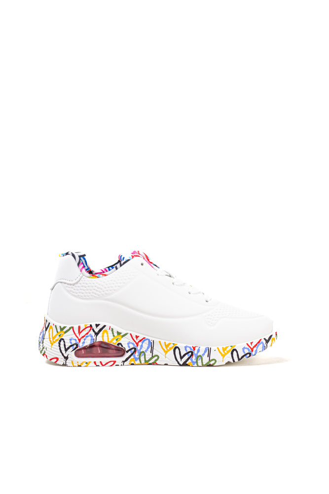 Zapatillas blancas para mujer con suela de colores vibrantes, expresión audaz y estilo dinámico para la vida urbana