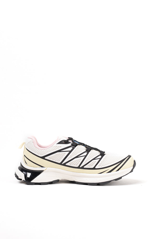 Zapatillas de trail running para mujer en blanco y negro, tecnología avanzada para el terreno más exigente