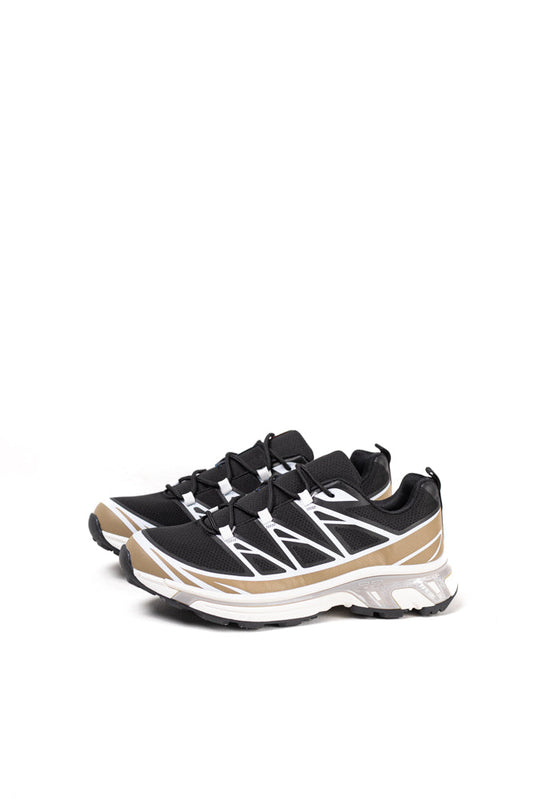 Zapatillas de trail running para mujer en blanco y negro, tecnología avanzada para el terreno más exigente