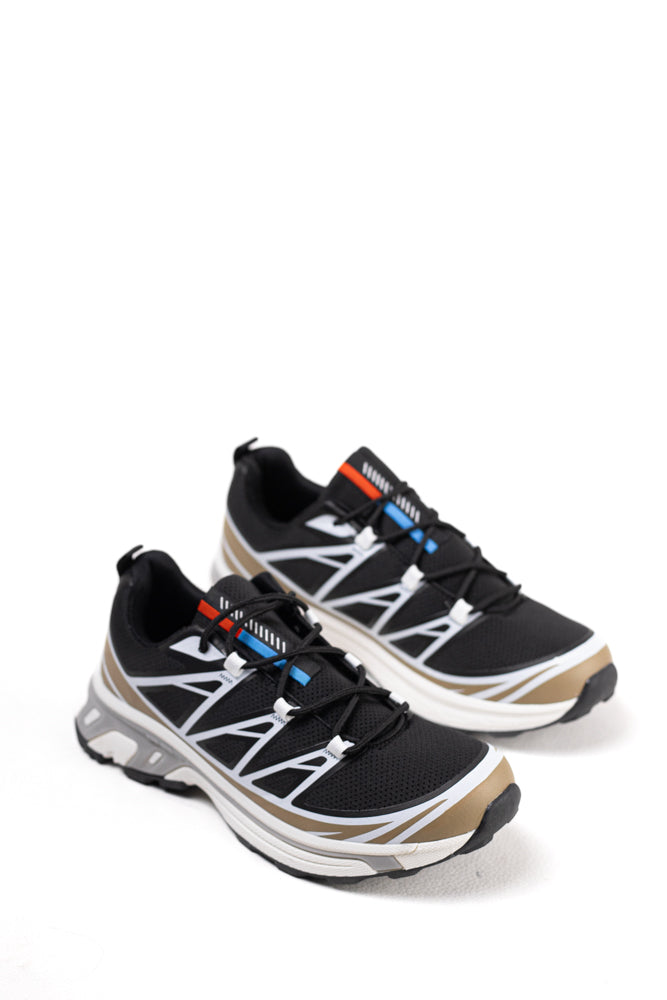 Zapatillas de trail running para mujer en blanco y negro, tecnología avanzada para el terreno más exigente