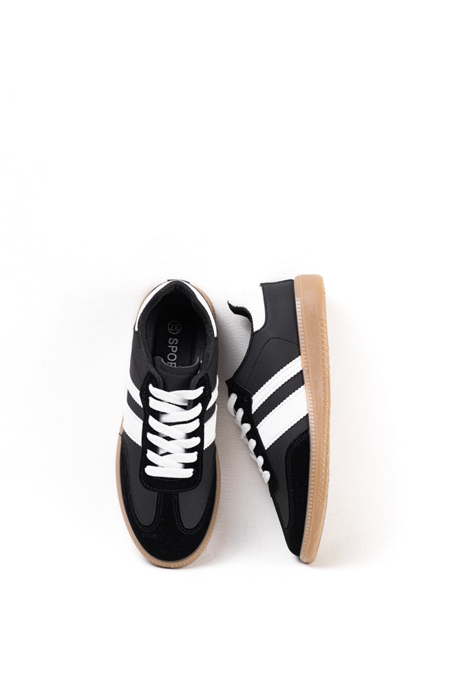 Zapatillas deportivas blancas para mujer con franjas negras, estilo clásico y comodidad para el uso diario