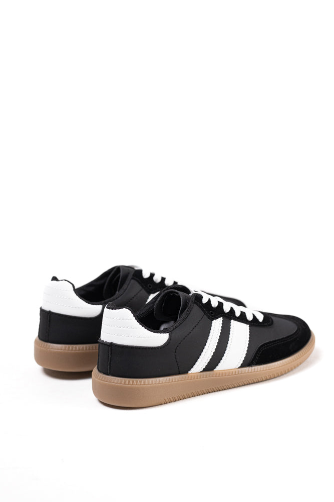 Zapatillas deportivas blancas para mujer con franjas negras, estilo clásico y comodidad para el uso diario