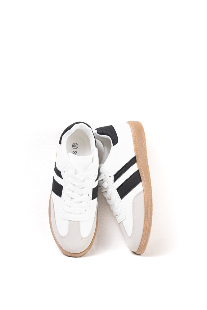 Zapatillas deportivas blancas para mujer con franjas negras, estilo clásico y comodidad para el uso diario